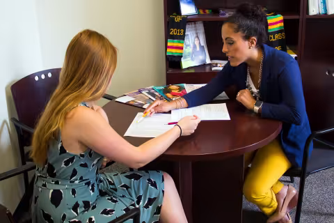 Yalitza Negron, Director of Internships and Career Services, consulting with a student