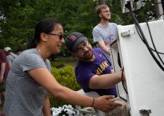 Postdoc Jason Covert (right). The University at Albany Atmospheric Sciences Research Center (ASRC), funded through $500,000 in support from the Department of Energy (DOE), works on a buoy-based flux measurement system at Lake George on Wednesday, June 30, 2021. (photo by Patrick Dodson)
