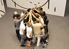 crowd of participants in a huddle