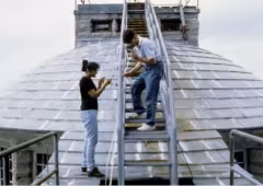 Two scientists on top of Whiteface Mountain studying cloud chemistry