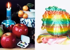 A still life next to a sculpture of some very colorful fruit.