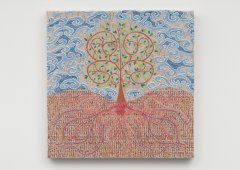 A art piece hangs on a wall, it is a canvac with an abstract of a tree made up of lines and colors on it.