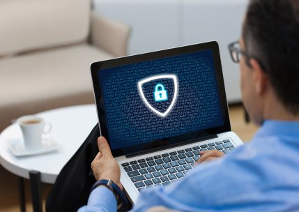 man working on computer security