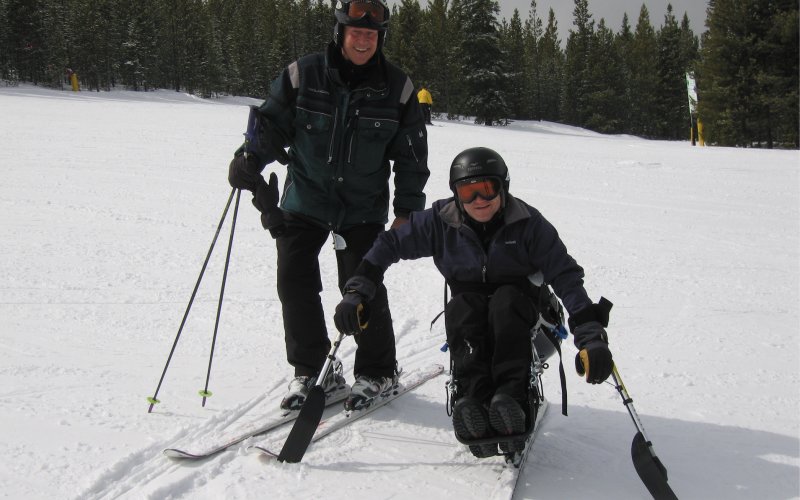Ron Forbes skiing with son