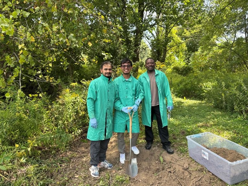 Group photo of lab members collecting samples in the field.