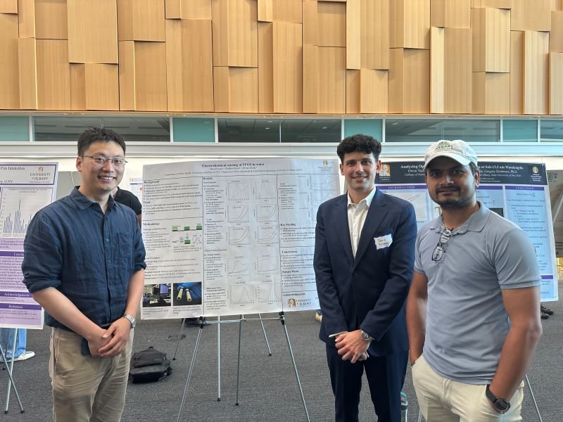Group at a poster session at ETEC.