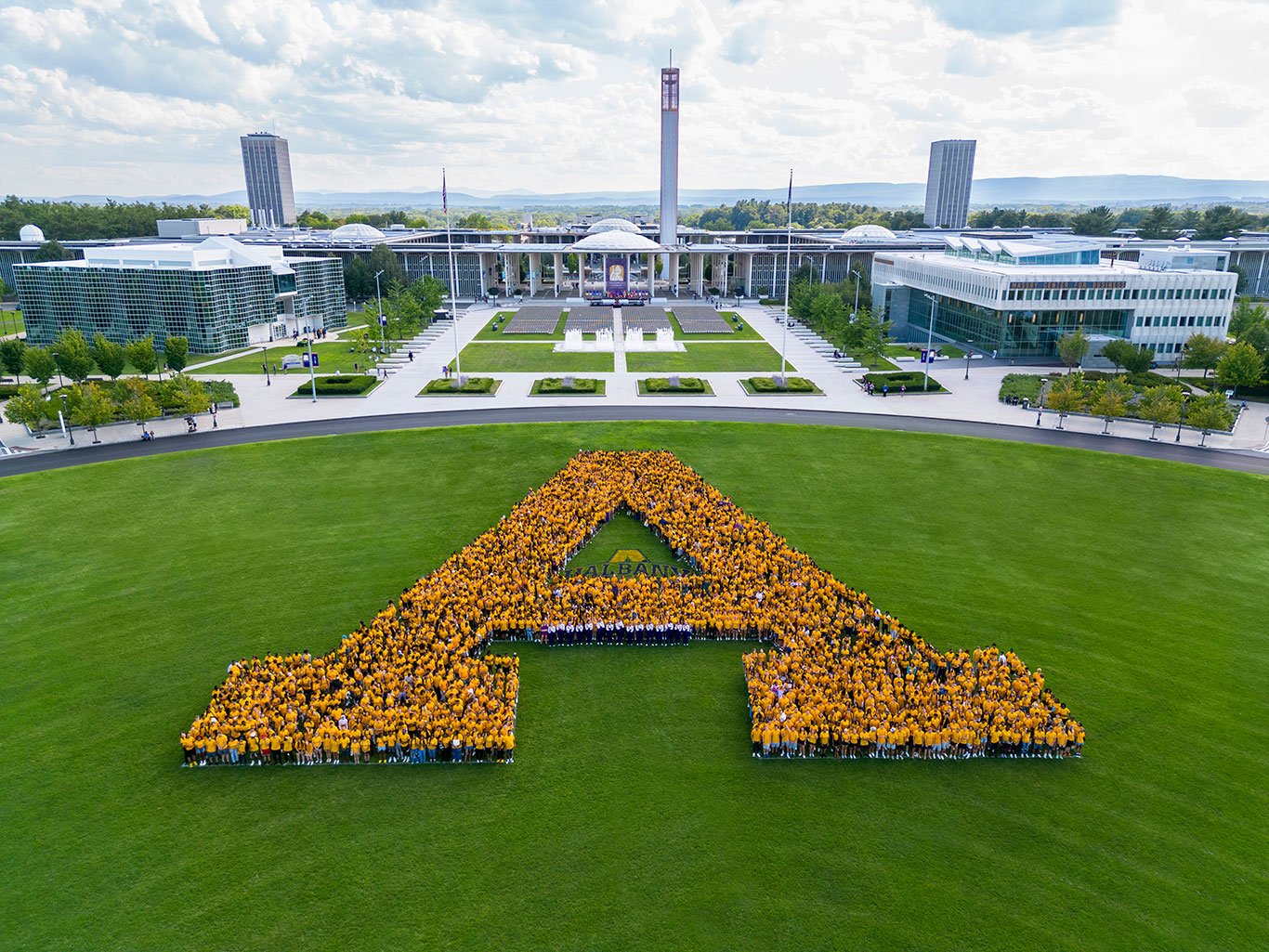 Students from the class of 2026 forming an A on Casey Stadium Field