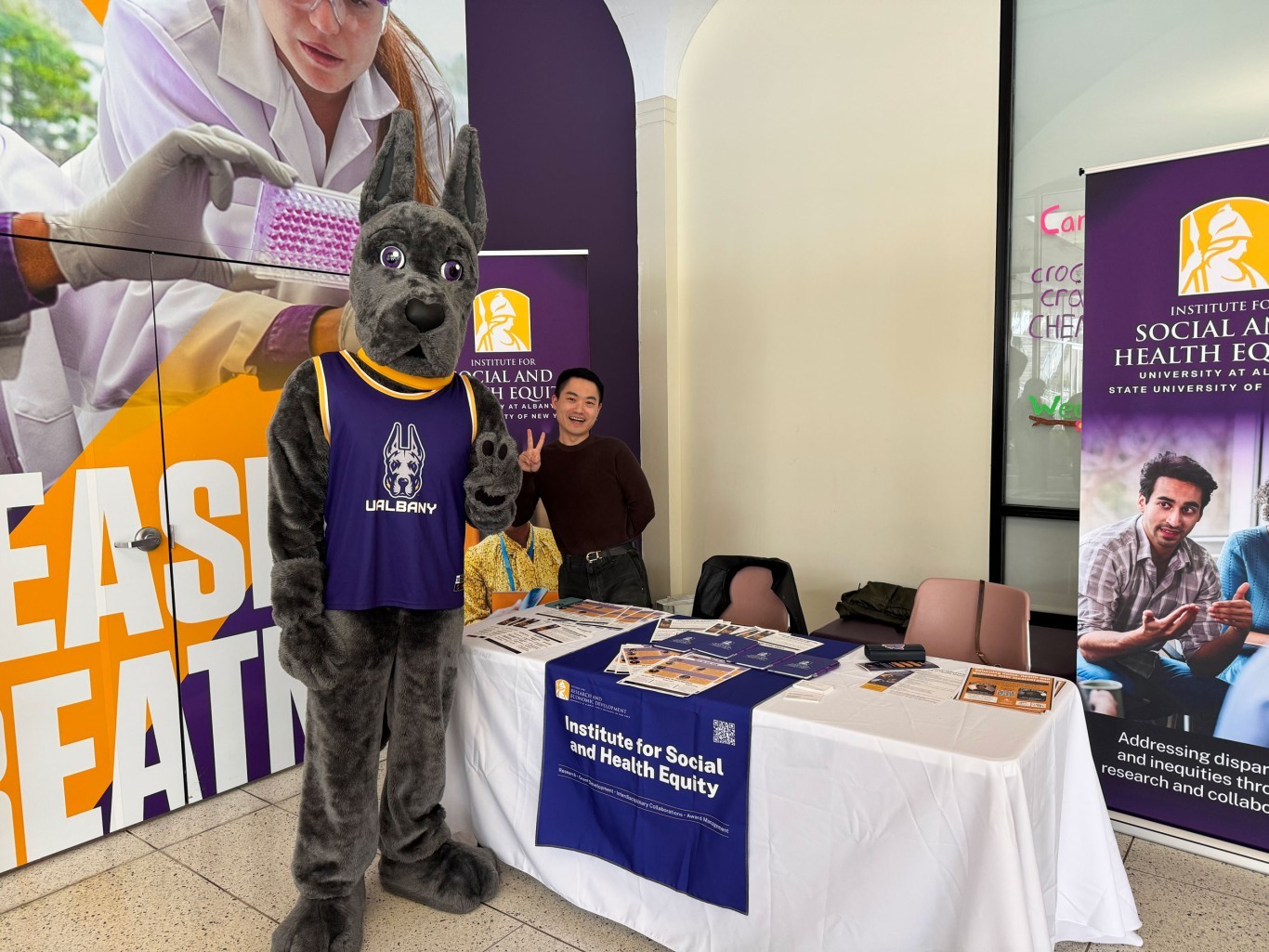 Damien and Eric Hengyu, Research Scientist, at Institute for Social and Health Equity (ISHE) table on UAlbany's 2026 Showcase Day.