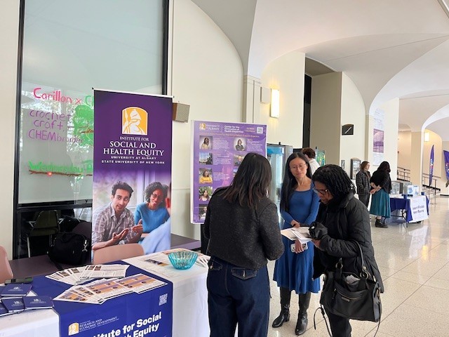 Attendees at UAlbany 2026 Showcase Day with Institute for Social and Health Equity (ISHE) staff and (in middle) Tianning Huang, Director of Office of Strategic Initiatives at UAlbany.