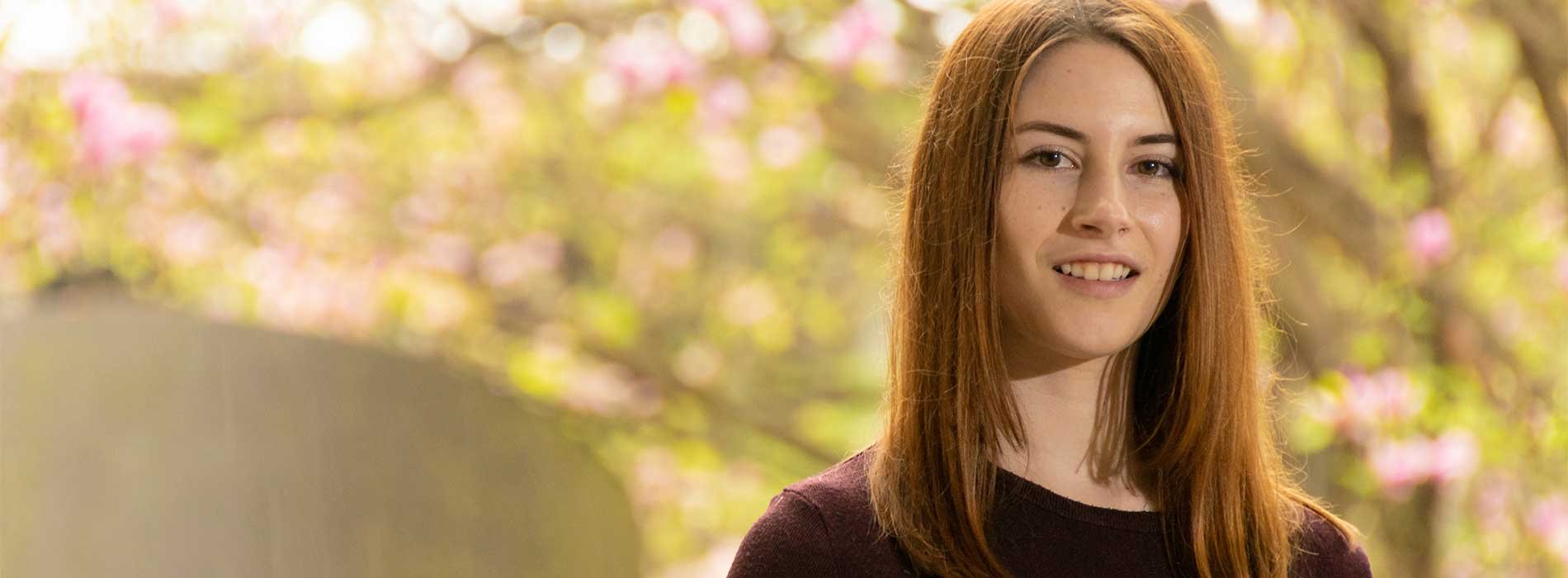 Chelsea Snide in garden in the spring.