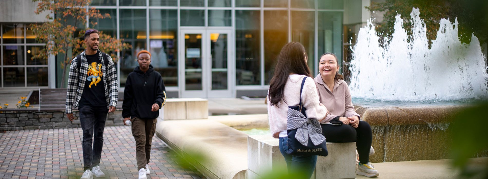 Students gather around a common area on the UAlbany campus