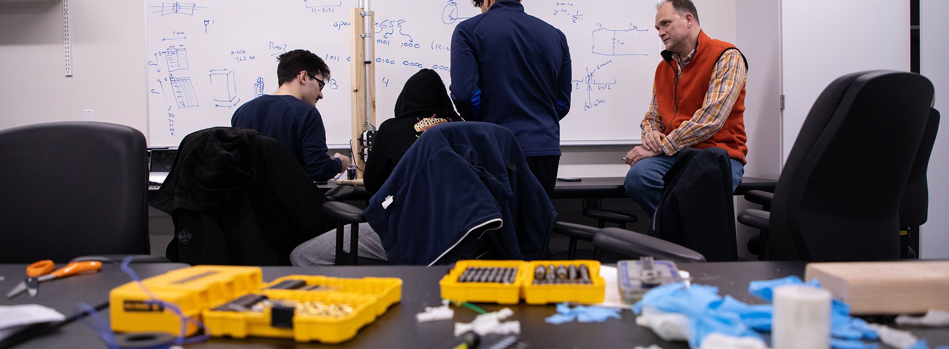 Students in the Systems Analysis and Design work on projects building a Tensiometer for the Chemistry department