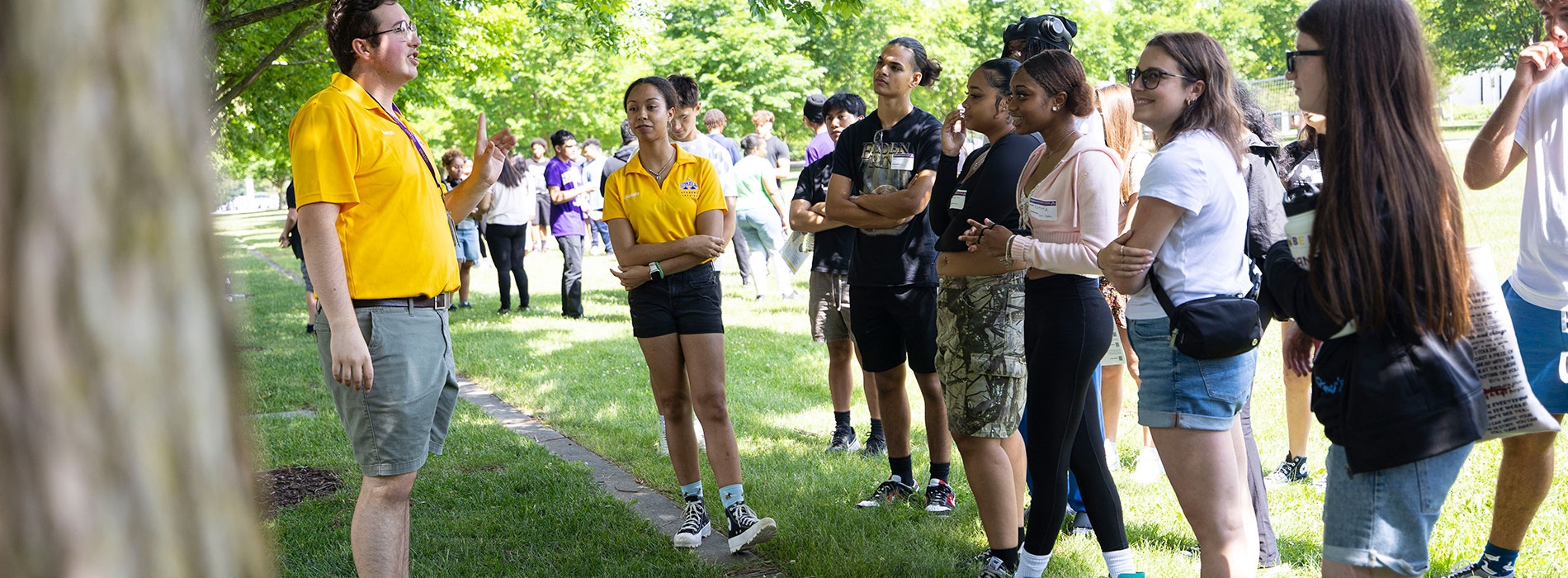 A group of new UAlbany students talking with their Orientation leaders.
