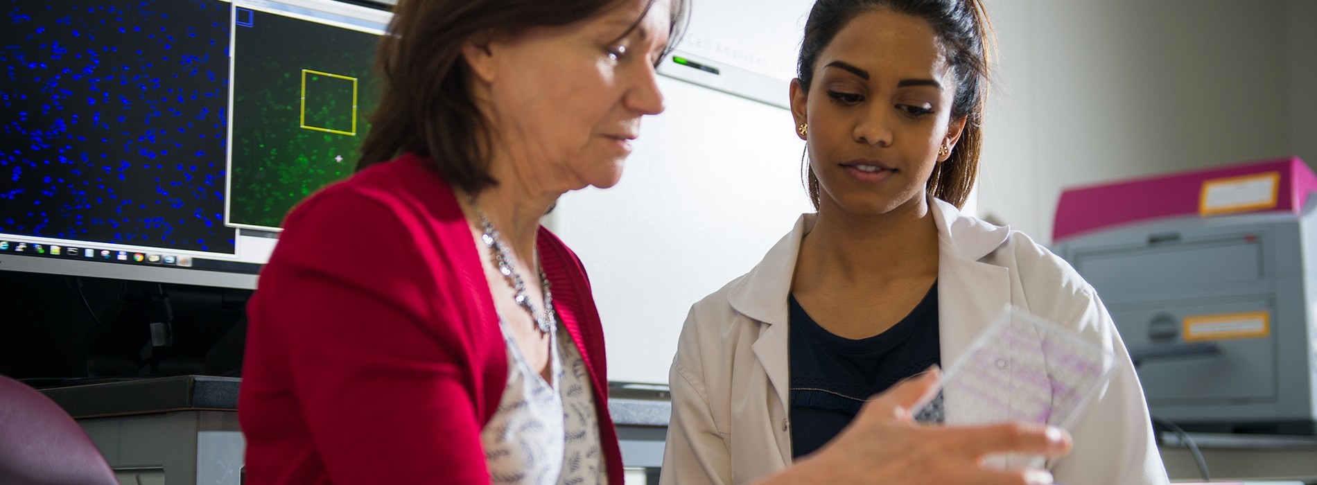 Two women in a lab working together. 