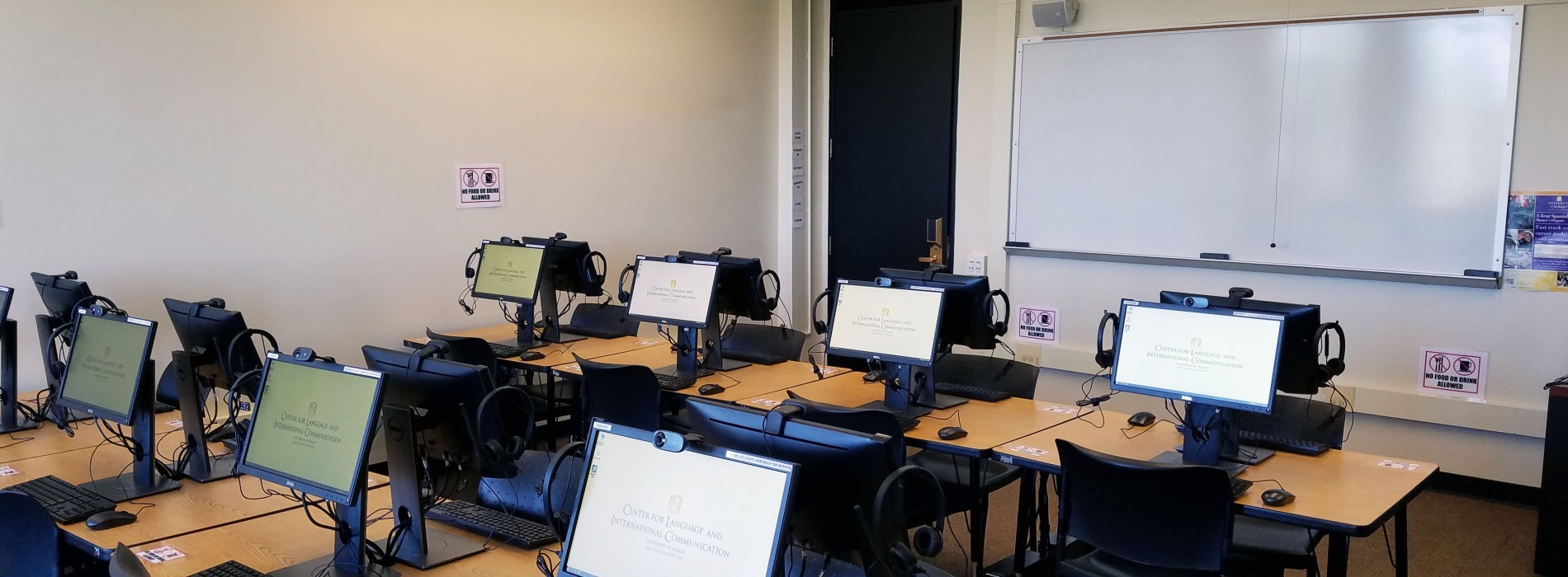 Language laboratory with computers turned on.