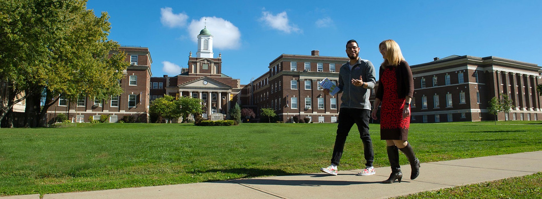 A student and faculty member walk outside on UAlbany's Downtown Campus.