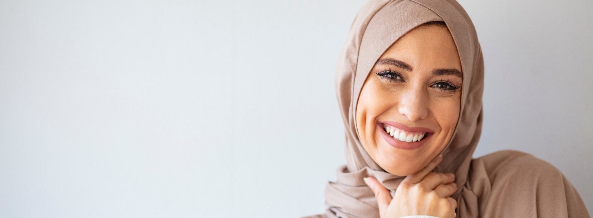 Smiling woman wearing head scarf