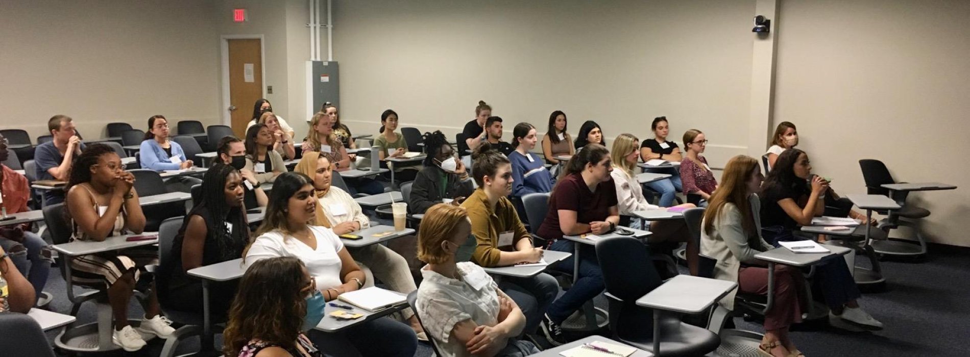 Students gathered in a classroom for the Global Health Fall Seminar Series