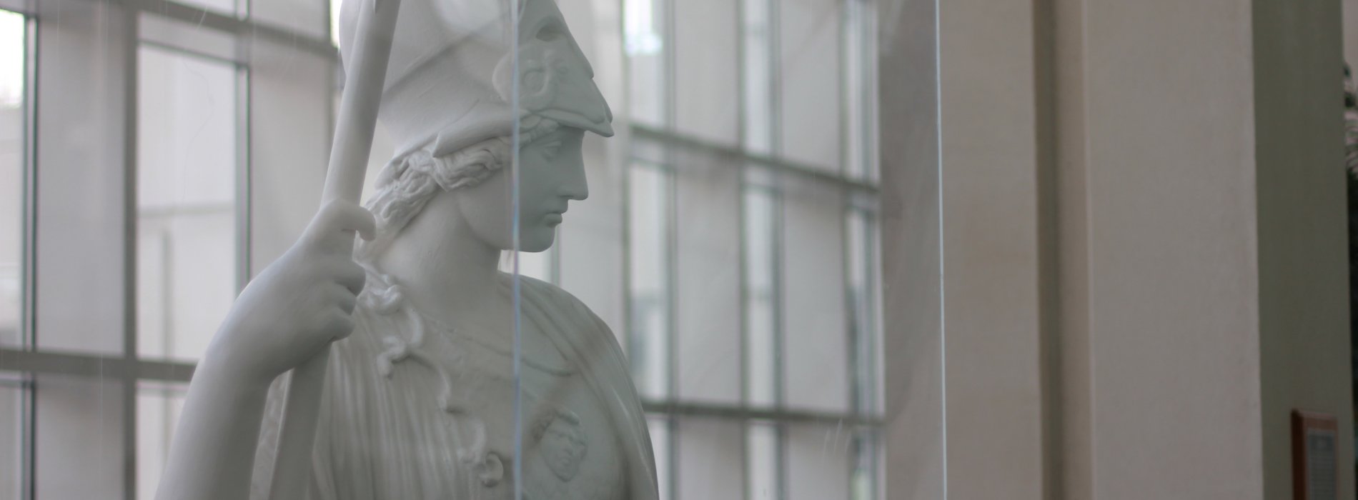A white plaster statue of Minerva, the Roman goddess of wisdom