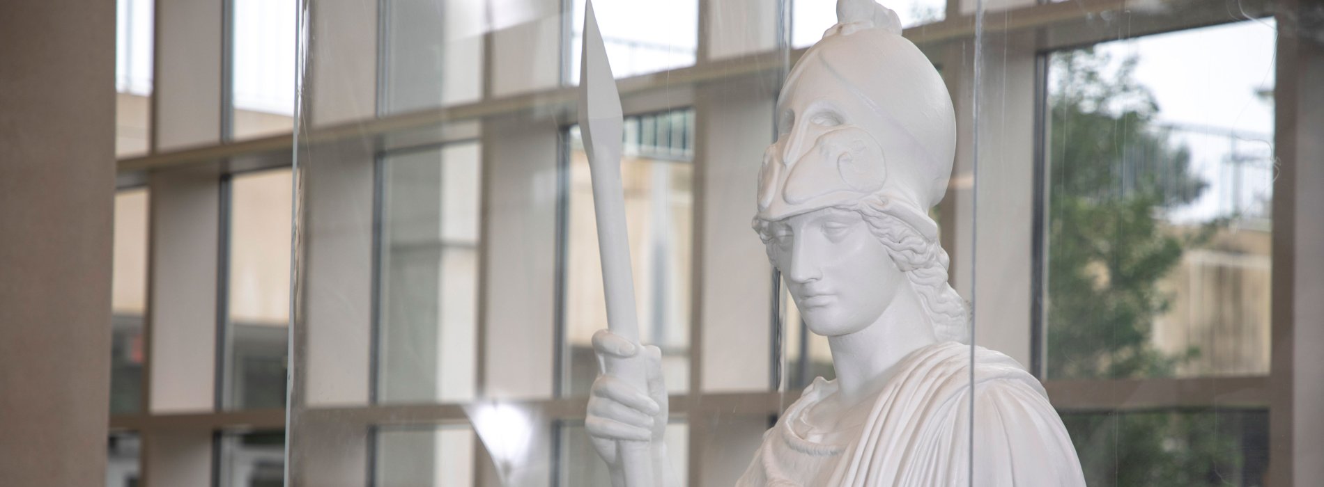 A white plaster statue of the Greek goddess of knowledge, Minerva.