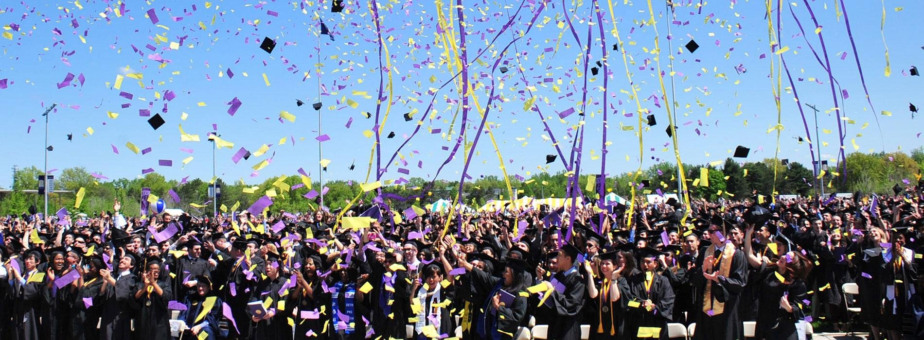 Undergraduate students at commencement showered in confetti