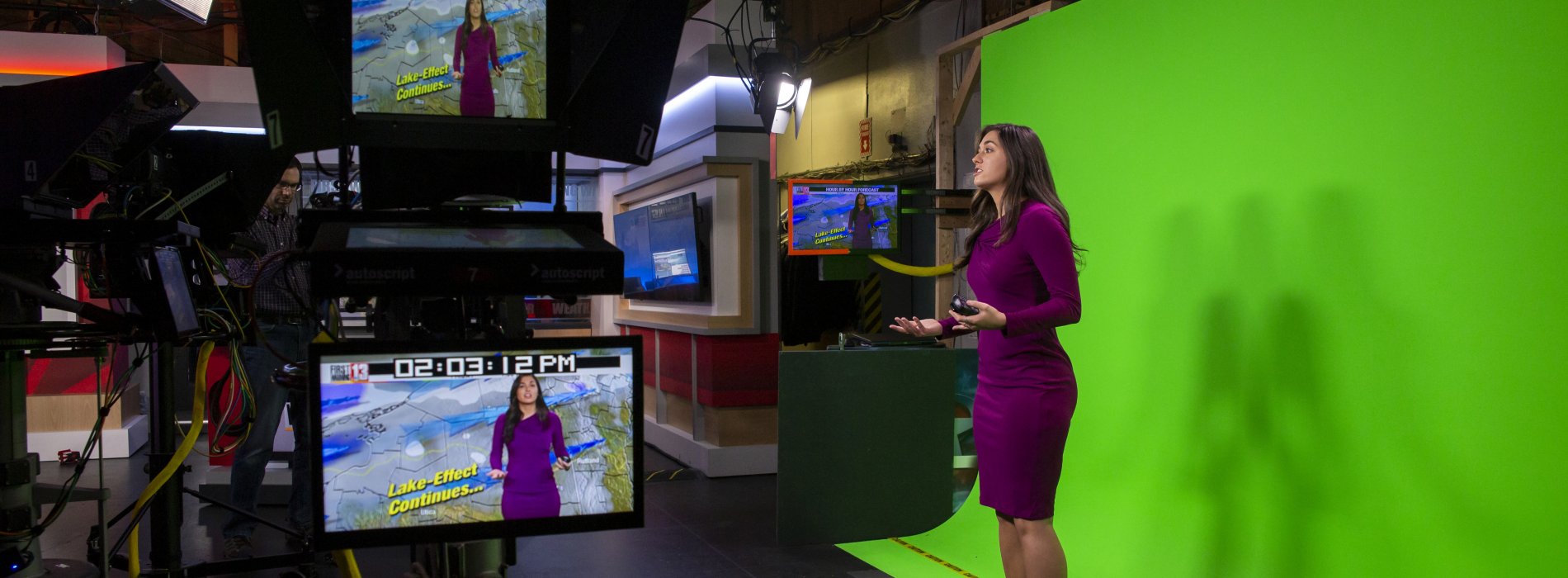 An Atmospheric and Environmental Sciences student interns as a weather broadcaster at WNYT. 