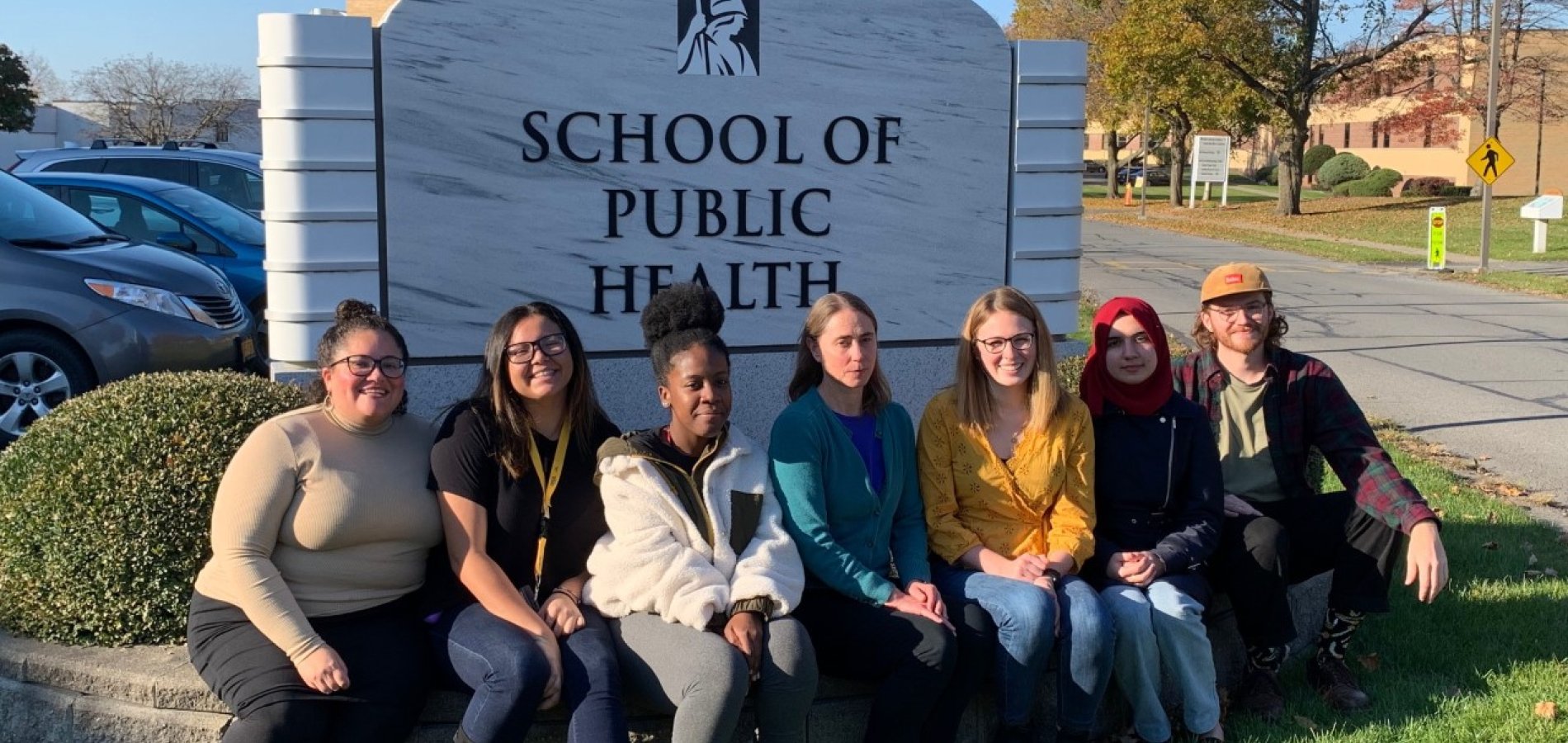 PFAS Study UAlbany Team sitting in front of School of Public Health sign