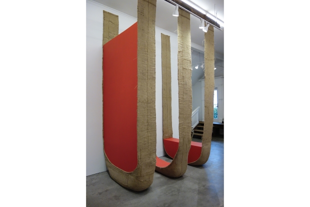 Suspended sculptures made from burlap with gyspum board within them.