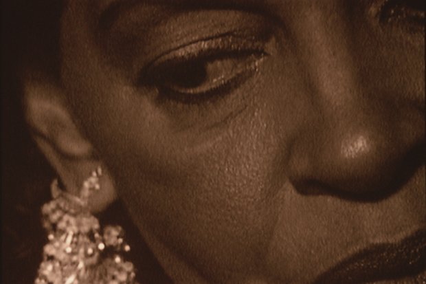 Close up of a persons face looking downward