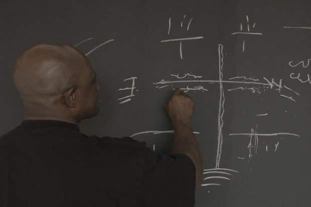 Person in front of a blackboard