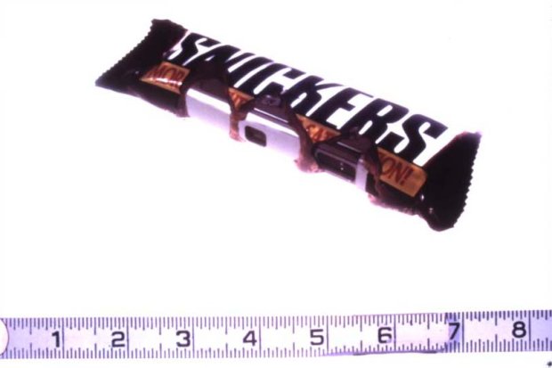 Snickers bar with a tape measure at the bottom of the image