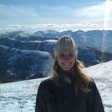 Amber Frye standing in front of mountains on a winter day