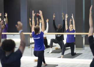 A group of students participate in a wellness class