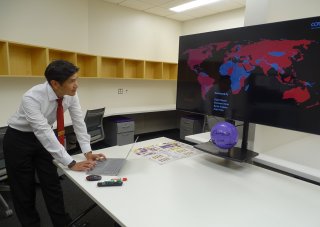 Ariel Pinto reviews a heat map displaying the global spread of malware attacks from the Cyber Risk Lab at ETEC.