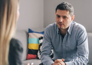 A substance abuse counselor meets with a client in her office.