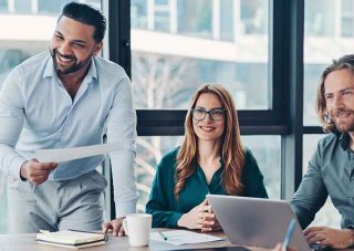 A team leader conducts a meeting in a conference room.
