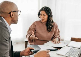 A human resources manager interviews a candidate for a position.