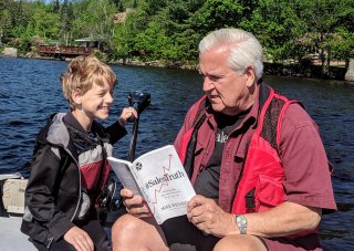 ​ UAlbany Professor Emeritus Bill Danko reads book to grandson ​ Danko reads Mike Weinberg's book to his grandson. ​ [Click and drag to move] 