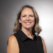 Dawn Bleyenburg with shoulder length hair and a black shirt