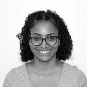 Amanda Delacruz, wearing glasses 