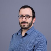 Dr. Rosenberg smiles at the camera.