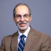 Dr. Altone smiles at the camera.