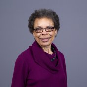 Annette smiles at the camera.