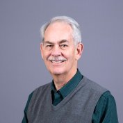 Dr. Smith smiles at the camera.
