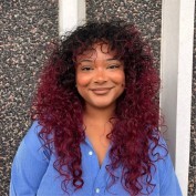 Sierra Mosley with red hair and a blue shirt