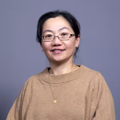 Dr. Chou smiles at the camera.