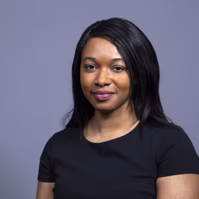 Dr. Adeyeye smiles at the camera.