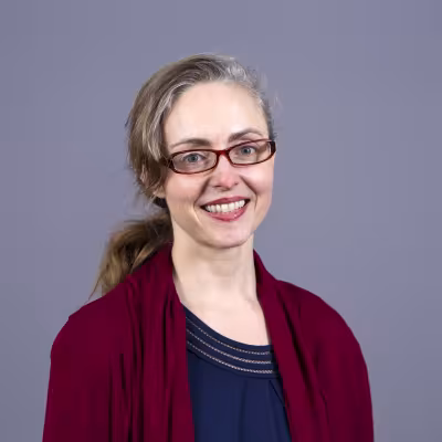 Dr. Emily Leckman-Westin smiles at the camera.