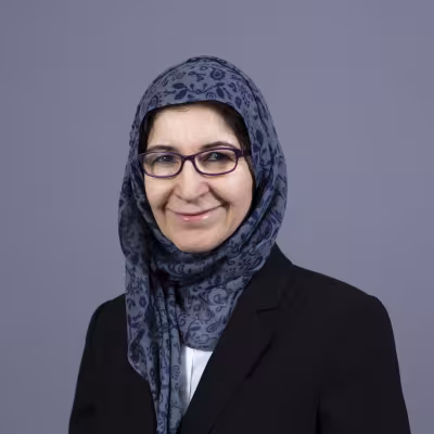 Dr. Almahamid smiles at the camera.
