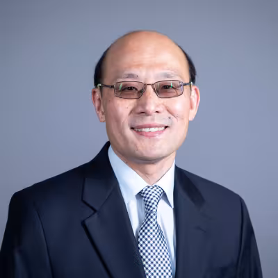 Liang Chu smiles at the camera.
